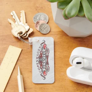 copenhagen pride metal keychains on table